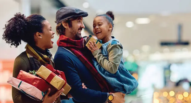 A family is shopping for holiday gifts