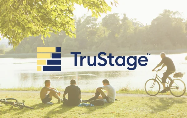 truStage logo on top of photo of group of people relaxing next to a lake